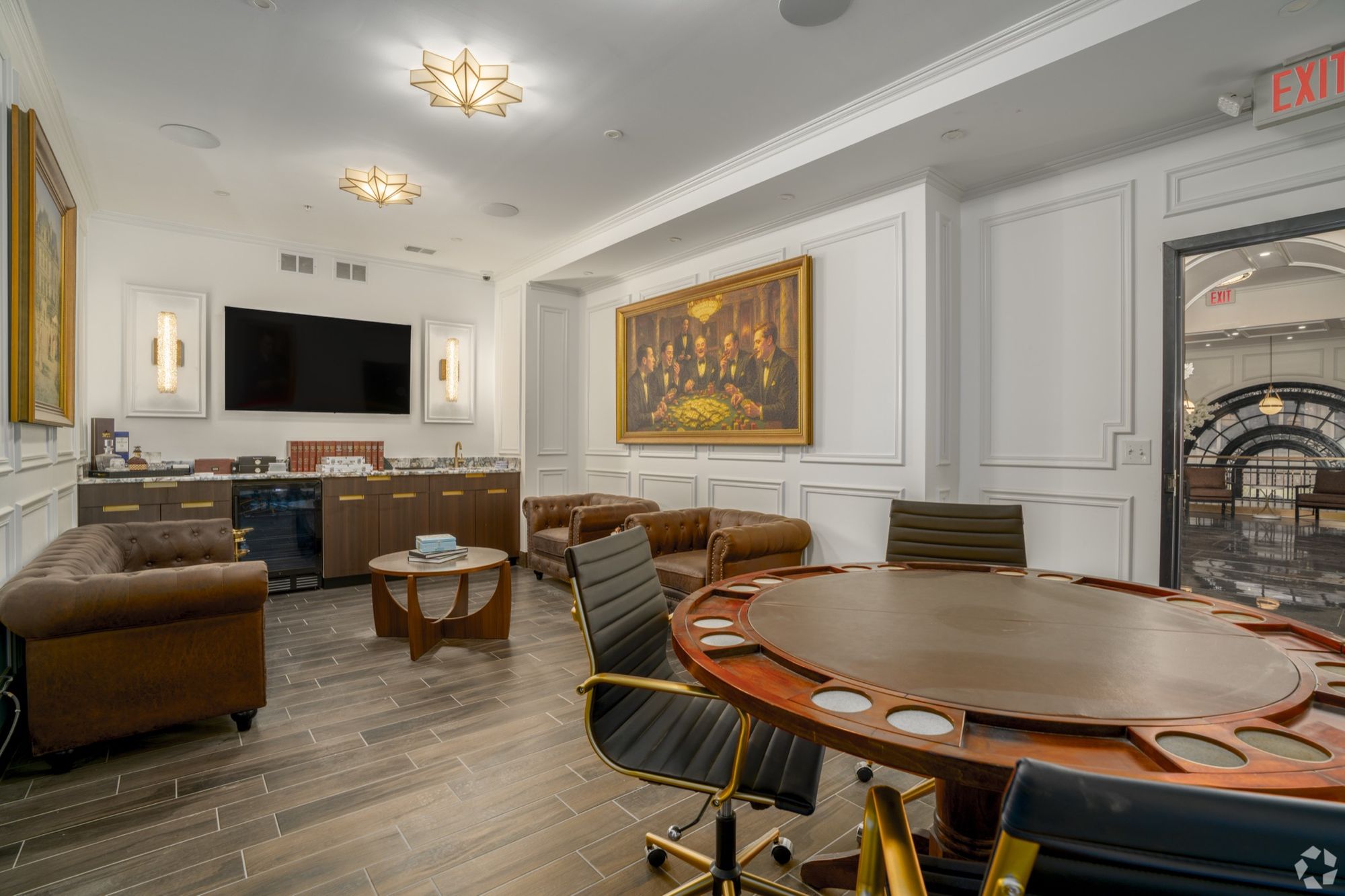 Resident lounge with leather sofas and a round table